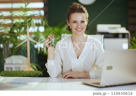 happy modern 40 years old woman realtor in modern green office happy modern 40 years old woman realtor in modern green office 110630618