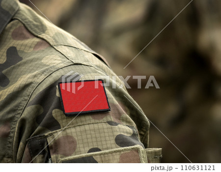 Red flag on military uniform. Red flag one of the first anarchist symbols. Anarchism Red flag. Red flag on military uniform. Red flag one of the first anarchist symbols. Anarchism Red flag. 110631121