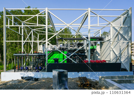 New modern unfinished wood chip biofuel boiler house for increased heat energy production efficiency 110631364