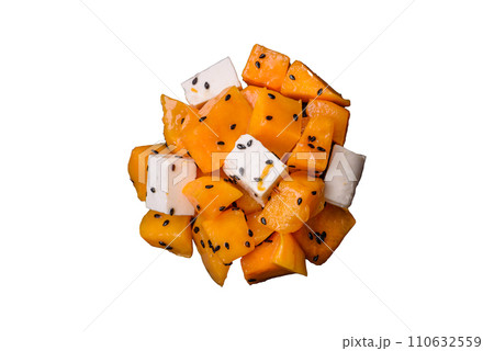 Delicious juicy salad of diced grilled pumpkin with feta cheese, spices and sesame seeds 110632559