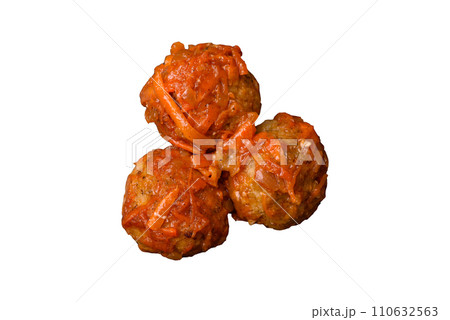 Delicious fresh meatballs from minced meat or fish with tomato sauce 110632563