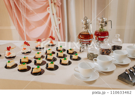 Dessert buffet with delicious sweet bakery and coffee-snack with stylish banks of lemonade and tea Dessert buffet with delicious sweet bakery and coffee-snack with stylish banks of lemonade and tea 110633462
