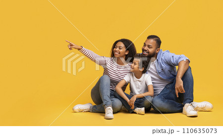 Family Offer. Happy Black Parents And Little Son Pointing At Copy Space 110635073