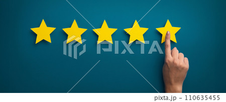 Woman hand showing on five star excellent rating 110635455