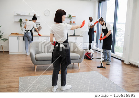 Professional housekeeper services company team working at customer house. 110636995