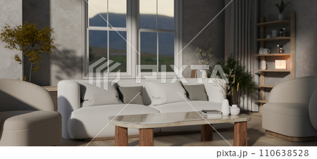 A modern, cosy living room with a comfortable white couch, a coffee table, and home decor. 110638528