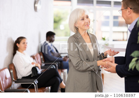 Adult man and elderly woman make an agreement 110638897