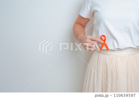 Woman having back abdomen pain with Orange ribbon. Kidney Cancer Awareness March month, disease of Urinary system and Stones, Cancer, Chronic kidney, Urology, Renal and Transplant concept 110639597