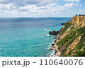 Top view of blue sea water with white waves and stones. 110640076