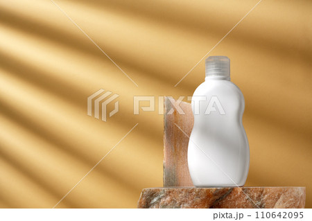 Cosmetic package dispenser with granite stone studio shot 110642095