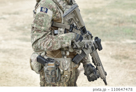 Soldier with assault rifle and flag of Belize on military uniform. Collage. Soldier with assault rifle and flag of Belize on military uniform. Collage. 110647478
