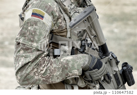 Soldier with assault rifle and flag of Colombia on military uniform. Collage. 110647582