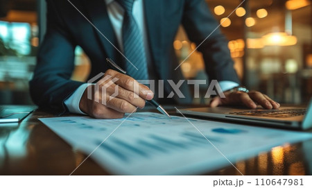 Elegantly dressed executive analyzing charts, showcasing expertise and precision in financial decision-making Elegantly dressed executive analyzing charts, showcasing expertise and precision in financial decision-making 110647981