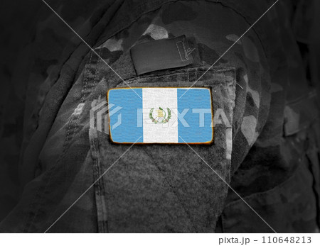 Flag of Guatemala on military uniform. Army, troops, soldier (collage). 110648213