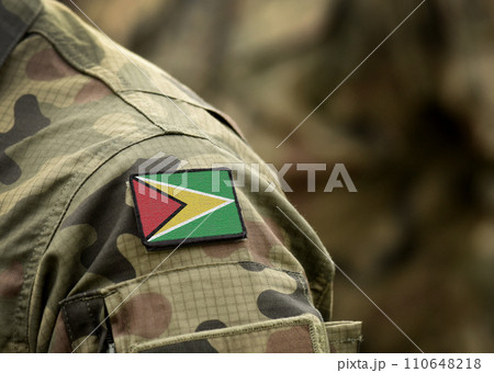 Flag of Guyana on on military uniform. Army, troops, soldier (collage). 110648218