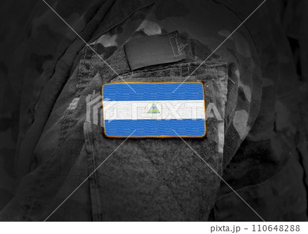 Flag of Nicaragua on military uniform. Army, troops, soldier (collage). 110648288