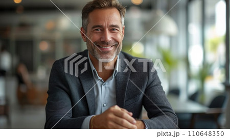 Suited businessman confidently presents strategic plans during a corporate meeting, exuding professionalism Suited businessman confidently presents strategic plans during a corporate meeting, exuding professionalism 110648350