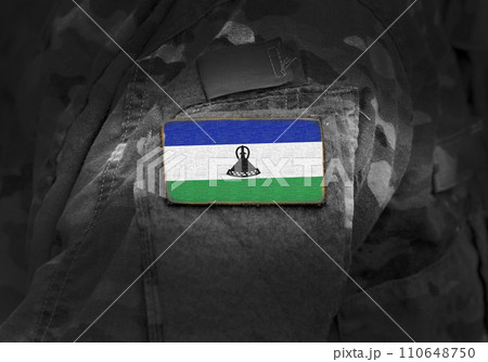 Flag of Lesotho on military uniform. Army, troops, soldiers. Collage. Flag of Lesotho on military uniform. Army, troops, soldiers. Collage. 110648750