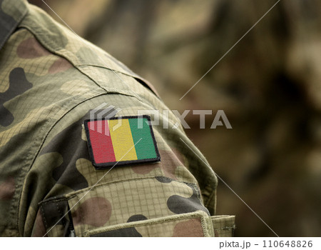 Flag of the Republic of Guinea on military uniform. Army, troops, soldiers. Collage. Flag of the Republic of Guinea on military uniform. Army, troops, soldiers. Collage. 110648826