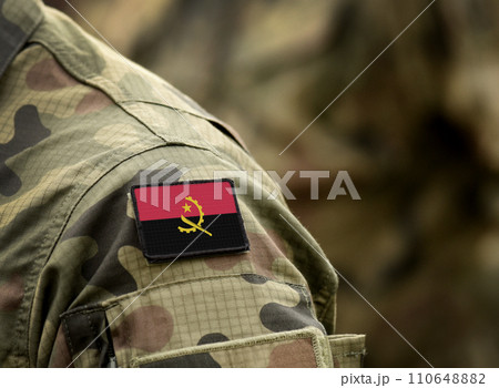 Flag of Angola on military uniform. Army, troops, soldiers, Africa,(collage). 110648882