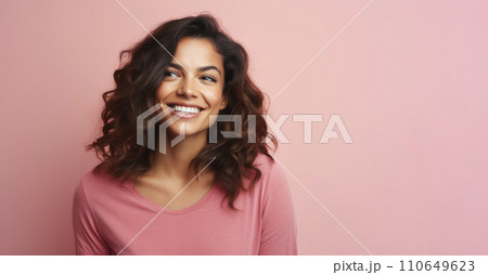 Portrait of happy smiling young woman in pink sweater over pink background. Portrait of happy smiling young woman in pink sweater over pink background. 110649623