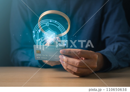 Businessman using mobile phone with cyber security login screen and holding credit card. Digital information technology and cyber security concept. 110650638