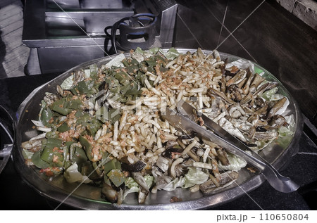 Fried rice with vegetables on a hot pan in a restaurant. Fried rice with vegetables on a hot pan in a restaurant. 110650804