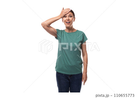 30 year old smiling slender brunette woman with collected hair is dressed in a green basic t-shirt 30 year old smiling slender brunette woman with collected hair is dressed in a green basic t-shirt 110655773