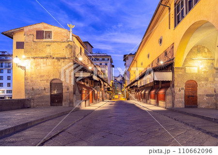 Golden bridge Ponte Vecchio in Florence at sunset. 110662096