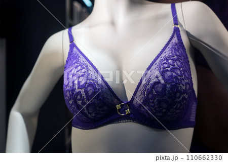 Closeup of purple bra on mannequin in a fashion store showroom Closeup of purple bra on mannequin in a fashion store showroom 110662330