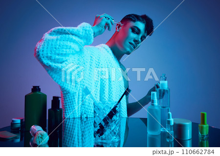 Glowing Duality. Step into radiant world of dual beauty as masculine and feminine converge in neon-lit bathroom. Glowing Duality. Step into radiant world of dual beauty as masculine and feminine converge in neon-lit bathroom. 110662784