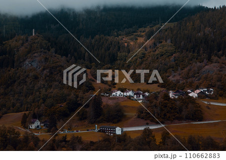 Secluded Mountain Village A Cozy Hamlet Nestled Amongst the Golden Hues of Fall. 110662883