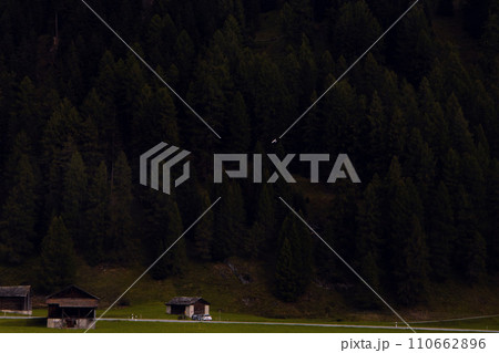 Secluded Retreat: Rustic Cabins at the Edge of a Forest, Quietude of Nature. 110662896