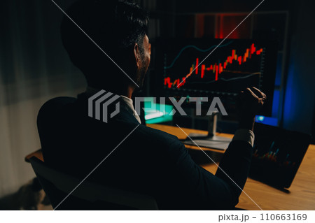 Thoughtful focused successful caucasian male stock investor, broker, financial adviser, sits at work desk, looks at computer, pensively analyze risks and prospects, rise or fall of cryptocurrency coin 110663169