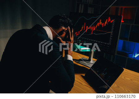 Thoughtful focused successful caucasian male stock investor, broker, financial adviser, sits at work desk, looks at computer, pensively analyze risks and prospects, rise or fall of cryptocurrency coin 110663170