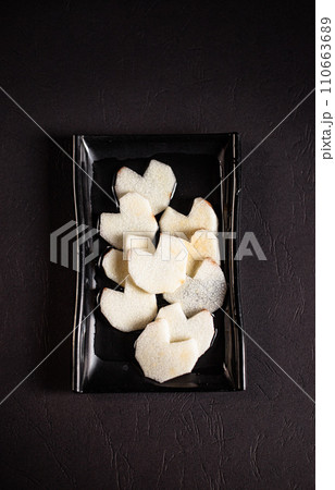 sliced ingredients in a flat black plate on a white background top view sliced ingredients in a flat black plate on a white background top view 110663689