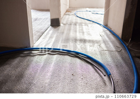 Sheet of expanded polystyrene on the concrete floor for house thermal insulation during constructions 110663729
