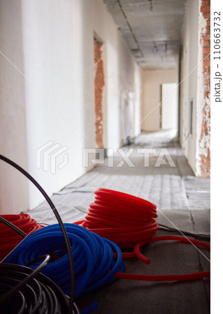 Sheet of expanded polystyrene on the concrete floor for house thermal insulation during constructions 110663732
