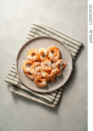 Cooked shrimps in a plate, seafood, bright background.  110663830