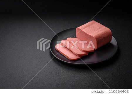 Delicious canned pink ham with salt, spices and herbs Delicious canned pink ham with salt, spices and herbs 110664408