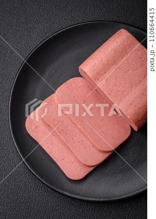 Delicious canned pink ham with salt, spices and herbs Delicious canned pink ham with salt, spices and herbs 110664415