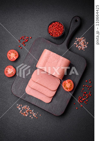 Delicious canned pink ham with salt, spices and herbs 110664425