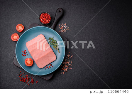 Delicious canned pink ham with salt, spices and herbs Delicious canned pink ham with salt, spices and herbs 110664446