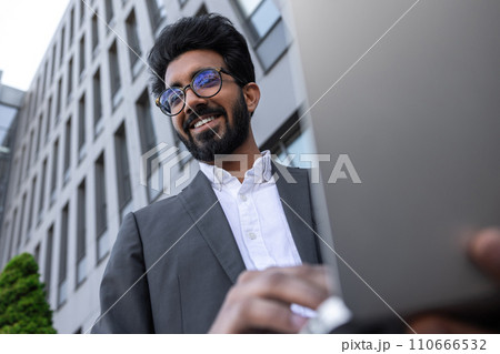 Young businessman in eyeglasses feeling positive and joyful 110666532