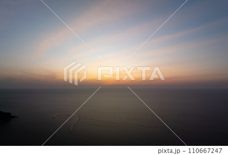 Landscape Sunset sky,Nature beautiful Light Sunset or sunrise over sea,Colorful dramatic majestic scenery sunset Sky with Amazing clouds and waves in sunset sky,Nature light cloud background 110667247