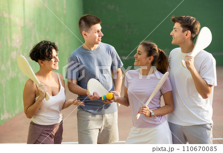 Basque pelota players chatting on outdoor fronton Basque pelota players chatting on outdoor fronton 110670085