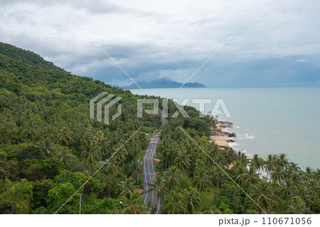 Aerial view of cars driving on highway or moterway. Overpass bridge street roads in connection network of architecture concept. Top view of forest trees. Nature landscape 110671056
