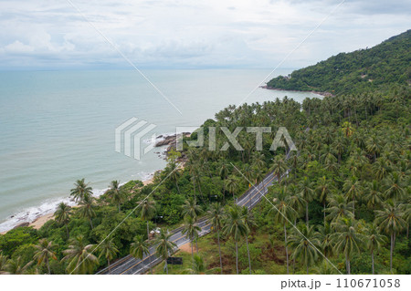 Aerial view of cars driving on highway or moterway. Overpass bridge street roads in connection network of architecture concept. Top view of forest trees. Nature landscape 110671058