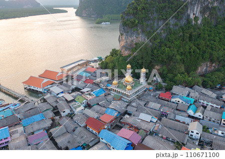 Aerial view of Koh Panyee, The Floating village urban city town houses, lake sea or river. Nature landscape fisheries and fishing tools at Pak Pha, Phang Nga, Thailand. Aquaculture farming 110671100