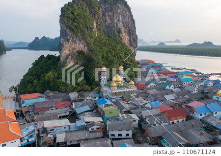 Aerial view of Koh Panyee, The Floating village urban city town houses, lake sea or river. Nature landscape fisheries and fishing tools at Pak Pha, Phang Nga, Thailand. Aquaculture farming 110671124